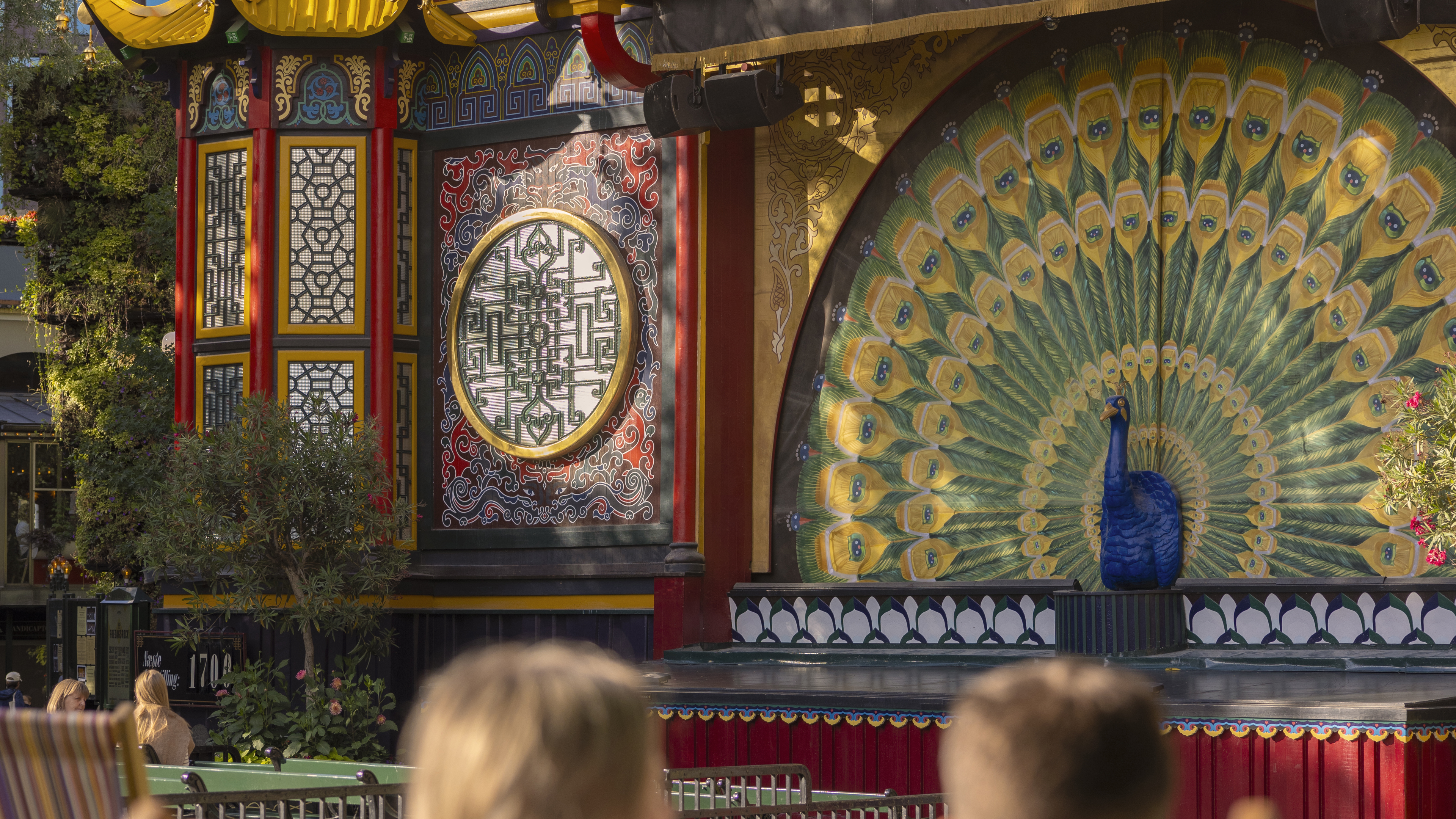 The peacock on the Pantomime Theatre in the sunshine.