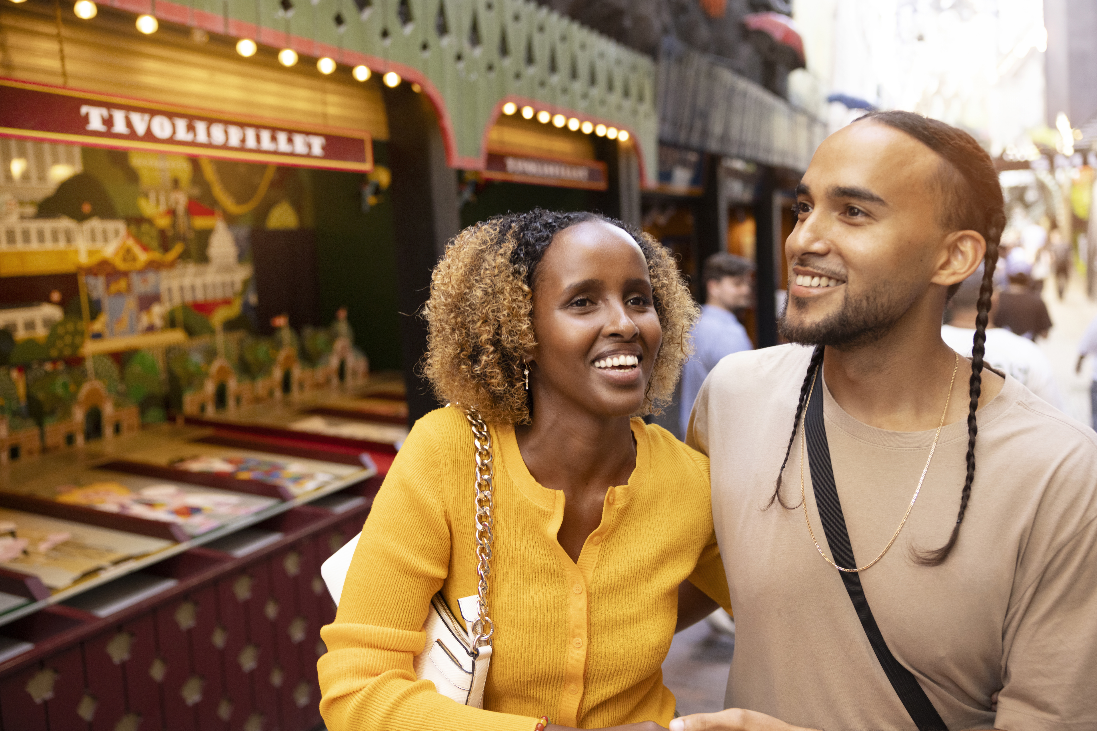 A smiling man and woman enjoying their time together in Tivoli.